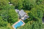 Quogue - Enjoy this spacious multi level contemporary completely redone home on picturesque acre lot. Enter thru the entry foyer to the Media Room with remote blinds and projection media player, enter into the main living area of the home Living Room w/fireplace, Dining area (both with sliders to deck), Euro Kitchen, Laundry room and powder room, down 1/2 level to Guest Bedroom, bath and game/exercise room, up to Master Bedroom and bath and up 1/2 level from there to 2 bedrooms and bath plus a loft with fireplace. Outside there is lots of lawn to enjoy plus a great deck with heated pool, hot tub, outdoor shower and a sport court, detached garage, accessible to Village Beach. Offered July and/or August - LD 2026., Additional information: Appearance: mint, Weekly Rental Amt:$15000/wk (2 week minimum)