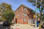 Welcome to 124-01 Hillside Avenue, a legal three-family brick corner property situated in the vibrant Kew Gardens neighborhood of Queens. Boasting a desirable south-facing exposure, this solid home is filled with natural light and offers a rare combination of stability, income potential, and prime location. The residence is thoughtfully designed across three levels, featuring a one-bedroom, one-bath unit on the first floor, a spacious two-bedroom, one-bath unit on the second floor, and another two-bedroom, one-bath unit on the third floor. Hardwood floors and fresh paint provide a clean, updated feel throughout, creating comfortable living spaces for both owners and tenants. Adding to its appeal, the property includes a large detached two-car garage, an uncommon and highly valuable feature in the city. With no basement to maintain, the building offers straightforward upkeep and reduced long-term concerns. This is an ideal opportunity for investors seeking a reliable, income-generating property, or for homeowners who wish to enjoy one unit while benefiting from rental income from the others. All units to be delivered vacant.Location is everything, and this home excels in convenience. Commuters will appreciate easy access to both the J subway line and the Kew Gardens LIRR station, ensuring quick connections to Manhattan and other boroughs. The neighborhood itself is known for its welcoming community atmosphere, tree-lined streets, and close proximity to parks, shops, restaurants, and daily essentials. Residents enjoy the perfect balance of urban convenience and neighborhood charm.Whether you are an investor, a homeowner, or a combination of both, 124-01 Hillside Avenue presents an outstanding opportunity to own a versatile and well-maintained property in one of Queensâ€™ most connected and desirable locations.