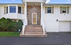 Spacious 4-Bedroom Hi-Ranch in East Northport â€“ Commack School District #10! Welcome to this beautifully maintained extended hi-ranch offering 4 bedrooms, 2 full bathrooms, and endless possibilities for todayâ€™s lifestyle. The home features a custom-built eat-in kitchen with sleek stainless steel appliances, perfect for everyday meals and gatherings. Enjoy the extended den filled with natural light, complete with a cozy electric fireplaceâ€”an ideal spot for family moments or entertaining guests. A formal dining room adds elegance, while additional flexible space can be used as a home office, gym, or playroom. Outside, the property shines with a circular driveway for easy parking and curb appeal, plus a shy half-acre of flat landâ€”the perfect canvas for outdoor living, play, or even your future dream pool. Located close to beaches, this home combines comfort, convenience, and community in one amazing package!