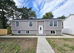 Beautifully Remodeled Home Offering 6 bedrooms, 2 Full Bathrooms, Livingroom, Dinning area, Nice Kitchen with stainless steel appliances, with 2 different separate entrances to the lower floor, laundry Closet, and a big back yard.