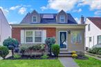 Elegant 4 bed, 2.5 bath cape situated on a quiet street, lot 4082 sqft. yet conveniently located steps away from grocery stores, bus stop, LIRR, and local eateries. Zoned for elementary school with a G&T program. Recently renovated with a NEW ROOF, SOLAR PANELS, EV charger, smart home features, mini split AC, gourmet kitchen with plenty of storage. Also features hardwood floors throughout, 3 heating zones, finished basement, luxury appliances, including wine fridge. Beautiful French doors lead out to a serene, private yard. Donâ€™t miss the opportunity to make this move-in ready, energy efficient home yours!