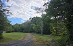 33.65 Acres with Road Frontage, Shale Pits, and Mountain Views - Cairo, NY 1927 Route 67 offers 33.65 acres with frontage on two roads and plenty of flexibility. The sellers have already added underground electric and high-speed fiber, plus a driveway leading to a potential building site with mountain views. The property includes two shale pits, a small tributary stream at the rear, and a mix of open and wooded land making it well suited for subdivision, horses, farming, hunting, or a private retreat. Set in a convenient Catskills location, you&rsquo;re close to local amenities, outdoor recreation, and just minutes to the Thruway for easy access to Albany or New York City. This acreage is ready for whatever vision you bring.