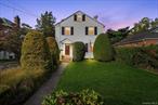 Rarely does a property of this size come available so close to the historic village downtown! This vintage 1948 Colonial is just moments from the train for an easy express ride into NYC and within walking distance to shops, caf&#233;s, and restaurants in the historic Incorp. Village of Amityville. Set on an expansive 178-foot-deep lot, the home welcomes you with a classic picket fence, oversized driveway, and private yard framed by perennial gardens. Inside, timeless details abound with hardwood floors throughout, solid wood doors, and original hardware. The home offers three bedrooms, two full baths, a formal living room filled with natural light, a formal dining room, and a lovely family room for everyday living. A screened-in side porch provides the perfect spot to relax and enjoy the outdoors.This special home combines vintage character with an unmatched location, offering both convenience and lifestyle in the heart of the village.