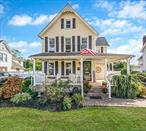 Welcome to 219 North Ocean Ave where timeless character meets village living. This 3 bedroom, 1.5 bath Victorian sits proudly in the heart of Patchogue, blending old-world charm and walkable convenience. The wide front porch, complete with its classic swing, welcomes you right away- perfect for morning coffee, peaceful evenings, and everything in between. Inside the home the first floor offers a living room, den, dining room, kitchen, and half bath, while upstairs features three bedrooms, a full bath, and laundry- all arranged for comfort and ease. Charming arched doorways and cozy nooks throughout add character at every turn. Outside you will find a fully fenced yard that is ideal for pets, gardening or summer gatherings. All of this is just a short walk to town where you will find great restaurants, shops, the theatre, and all of the other amenities the village has to offer. The virtually staged photos help spark ideas of what is possible- so bring your style, add your touch and make it your home.