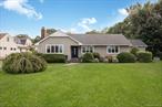 Expanded Ranch on Large Lot in South Amityville, Fireplace in Living Room, Granite and Stainless Kitchen, Primary Bedroom with en Suite Bath and Walk-in-Closet.