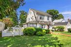 Lovely 1928 Colonial home located on a quiet tree-lined street. Features of this home include:3 Bedrooms, 2 baths, Extra large fenced yard (perfect for gardeners), sun-room, Formal dining room, original 1928 parquet boarder floors, full renovated basement, full renovated attic, garage, Deck and Portico. Also included are many upgrades (too numerous to list). The house has oil heat. Easy commute to Manhattan, LIRR Lynbrook Station is 1 mile distance. Annual Real Estate taxes are: $15657. Broker is the owner.
