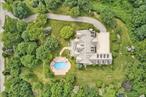 This stately brick Colonial seamlessly combines elegance and functionality, set on 2.5 acres of manicured grounds with specimen plantings. A grand two-story foyer introduces the homeâ€™s impressive scale, with generous proportions and thoughtful design at every turn. The dramatic sunken living room and formal dining room, highlighted by soaring Palladian windows, provide an elegant backdrop for gatherings both large and small. At the heart of the home, the chefâ€™s kitchen boasts a striking marble island, breakfast bar, and sunny dining area that flows directly to a brick patio, perfect for al fresco dining and entertaining. Just beyond, a bright and inviting great room with fireplace offers the ideal setting for relaxed everyday living. The first-floor primary suite is a true retreat, featuring dual walk-in closets, a private dressing area, and a spa-like bath with soaking tub and separate shower. Upstairs, four spacious bedrooms, two full baths, a versatile bonus room, and a lounge area with abundant storage complete the second level. Step outside to a private oasis designed for year-round enjoyment. A heated pool, expansive terrace, and panoramic views create the ultimate backdrop for summer barbecues and memorable gatherings. Perfectly positioned on a tranquil cul-de-sac, this home offers peace and privacy while remaining just minutes from Armonkâ€™s shops and dining, with easy access to Mount Kisco, Greenwich, and major highways. Located within the highly regarded Byram Hills school district, this property is the perfect blend of luxury, comfort, and convenience.
