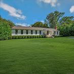 Experience the pinnacle of luxury at 262 Huntington Bay Road, Huntington Bay, NYâ€”an exquisite raised ranch that embodies sophisticated living. Nestled within the Fleetwood Acres Association, this fully renovated 2018 residence unfolds across an impressive 3, 700 square feet of elegant living space, set on over an acre of lush grounds. Upon entering through the private pillared entry, you are greeted by a modern open foyer enhanced with brass inlaid wood floors and custom iron railings. This leads into a chic, sophisticated chef&rsquo;s kitchen complete with top-of-the-line Thermador appliances, gas cooking, gold fixtures, and stunning white foil embossed cabinetry paired with marble countertops and backsplash. The adjoining living and dining areas boast vaulted ceilings, oak hardwood floors, and a cozy gas fireplace, making it a perfect space for both relaxation and entertaining. This home offers five bedrooms and three luxurious bathrooms. The primary suite is a haven of tranquility, featuring an expansive 11&rsquo;x10&rsquo; walk-in closet and a Carrara marble bath with a claw foot tub, promising moments of serene indulgence. The lower level is a sanctuary of versatility, with polished cement flooring, ideal for an office, recreation space, and bonus rooms. It leads seamlessly to the outdoor country club yard through glass bi-fold Tuscany doors. Enjoy the terraced patio, deck, and a dedicated pickleball/sports court, offering ample space to relax and enjoy nature at its finest. This home is truly a masterpiece for a visionary seeking luxury, privacy, and sophistication. Located only a few blocks from the bay and Head of the Bay Club. Beach rights in deed. Two electric car chargers, whole house water filtration system and so much more (see attached amenties sheet).