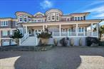 Outstanding state-of-the-art professionally decorated 7300SF oceanfront home. Each of the 7 en-suite bedrooms have panoramic ocean and bay views. The home has a grand entry foyer with a majestic sweeping staircase and opens to a double-sized living room (one of 2 living rooms) with a fireplace, wet bar, and side poolroom. French doors lead to an extra large oceanfront heated Gunite pool with a jacuzzi and is surrounded by ample decking and designer outdoor furniture. The level also has 3 en-suite bedrooms, an elevator, a back staircase, and stairs into the 2 car garage. The 2nd floor has an enormous Master suite with floor-to-ceiling windows showcasing an expansive ocean view. There are stunning built-ins and a wet bar. The stunning bath offers magnificent bay views, a large soaking tub, a large shower, and double sinks. and bidet all with top-line fixtures. Additionally on this floor are the additional bedrooms, the 2nd beautifully designed and professionally decorated living room with a fireplace. and balcony to step out onto and see the panoramic view of miles of an unpopulated Oceanfront and additionally the most amazing sunsets over the bay. The adjoining large dining room also has sweeping views of the ocean. It leads into the gourmet, designer, eat-in kitchen with superior top-line appliances offering all the bells and whistles. The breakfast nook has semicircle floor-to-ceiling windows with mile long views of the ocean waves breaking on the wide beach. This floor has a wood-paneled office with built-ins and also a semicircle wall of windows with remarkable unobstructed bay vistas. An ample elevator travels to all floors. The 2 acre property has 180&rsquo; of premiere ocean frontage and beautiful open bayscapes. There is a 3rd floor widow&rsquo;s walk with the most breathtaking bay and ocean vistas. Add to this a very private setting and you have an exceptional and rare summer rental.*also available July 15th to Sept 7th, 2026 for $350, 000
