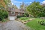Welcome to this beautiful 5-bedroom, 2-bathroom expanded Cape on a tranquil, tree-lined street in a wonderful neighborhood. This beautifully maintained 1, 834 sq ft home blends classic character with thoughtful updates throughout. The main level features gleaming hardwood floors, original architectural details, and natural woodwork that add warmth and sophistication. The heart of the home is the eat-in kitchen with white cabinetry, tile flooring, and sink overlooking the beautiful yard. The formal dining room, painted in a designer shade, flows seamlessly into the inviting living room with its cozy fireplace and recessed lighting. Two bedrooms and full bathroom complete the main level. Upstairs, you&rsquo;ll find three additional well-appointed bedrooms with excellent natural light and ample closet space. The full unfinished basement offers tremendous potential for additional living area or storage. Outside, enjoy the private, level backyard with mature landscaping, perfect for entertaining or play. Additional features include an attached one-car garage and beautiful patio and porch areas. This home offers the perfect combination of charm, space, and location.