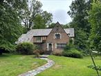 A rare opportunity to restore one of the most beautiful homes in the area. This stately 1930 Tudor offers nearly 3, 700 square feet of living space, with 5 bedrooms, 3 full bathrooms, and 2 half baths â€” all wrapped in timeless architectural charm that simply canâ€™t be replicated today. From the moment you arrive, the homeâ€™s curb appeal is undeniable. Classic steep-pitched rooflines, elegant brickwork, original stone accents, and decorative Tudor detailing create an exterior that turns heads and tells a story. The enclosed porch, flagstone patio, and attached garage only add to its character and footprint. Inside, the home is in need of a complete renovation â€” including all new windows, full interior updates, and mechanical overhauls. But beneath the surface lies incredible potential. Generously sized rooms, high ceilings, original details, and a smart, flowing layout offer the ideal foundation to transform this property into something truly special. Whether you restore its historic elegance or bring a modern design to a classic frame, this property provides the square footage and structure to support a high-end result. With the right investment, this home could easily become a standout resale or flagship rental in a strong market. This is a project for serious buyers with vision â€” a full gut renovation is required, but the upside is substantial. Comparable renovated homes in the area suggest a significant return on investment, and this propertyâ€™s combination of size, layout, and original charm make it one of the more promising value-add opportunities available today.  Sold strictly as-is. Showings by appointment only.