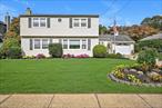Welcome to 11 Pittsburgh Avenue in Massapequa. This spacious Colonial offers 5 bedrooms and 2 full bathrooms sitting on a 70 x 100 lot. The main level features a large living room, kitchen with dining area, cozy den, one bedroom, and a full bathroom. Upstairs, youâ€™ll find four well-sized bedrooms and an additional full bathroom, providing comfort and flexibility. An enclosed rear porch and wood deck extend the living space, perfect for entertaining or relaxing. Additional highlights include a one-car attached garage and a private backyard. Conveniently located near schools, parks, shopping, dining, and transportation. Donâ€™t miss the opportunity to make this home yours!