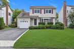 Greenlawn Village Colonial! This charming home features three bedrooms & 1.5 baths on a quiet village street in Harborfields. The front hall entry leads to the spacious living room with bay window & hardwood floors. Just off the living room is your dining room open to the updated center island kitchen with stainless steel appliances & granite counter tops. Enjoy the cozy den with access out to the fenced yard. A guest half bath completes the first level. The second level boasts a primary bedroom with dual entry bath, two additional bedrooms & walk in attic storage space. Additional features include a full lower level with laundry, utilities & storage, one car attached garage, gas heat, Andersen windows & CAC. Conveniently located close to Village shopping, restaurants, library and train station. Will not last!