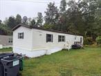 This charming 2-bedroom, 1-bathroom mobile home is situated in a serene park, conveniently located between Kingston and Woodstock. The home features a cozy layout with a bright living area that flows into a functional kitchen, perfect for family meals. Both bedrooms are spacious, providing ample storage and comfort.Outside, you&rsquo;ll find a generous outdoor space ideal for relaxing or entertaining, complete with room for gardening or enjoying the fresh air. The quiet park setting adds to the appeal, offering a peaceful retreat while still being close to local amenities and attractions in both Kingston and Woodstock. Whether you&rsquo;re looking to downsize or seeking a peaceful getaway, this mobile home could be the perfect fit.