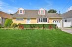 Welcome to this inviting Cape Cod style house that perfectly blends comfort and funtionality. Offering four bedrooms and three full bathrooms. The first floor features a spacious living room with hardwood floors that flows seamlessly into the open formal dining room and modern eat-in -kitchen. The kitchen is a true highlight , showcasing granite countertops, a decorative backsplash, stainless steel appliances, a skylight that floods the room with naural light, and sliding glass door with direct access to backyard. The convenience of a first-floor primary bedroom with its own ensuite bathroom adds to the home&rsquo;s appeal. The second level offers three bedrooms and a full bathroom. The full finished basement is an entertainer&rsquo;s dream, complete with a bar, recreation space, additional bathroom, and a laundry room./utility room. Step outside to enjoy the backyard oasis featuring a wooden deck off the kitchen, with a retractable awning for shade, and a beautifully maintained lawn ideal for gatherings or relaxation . With great curb appeal, a private driveway, and a one car garage, this home truly has it all.