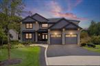 This extraordinary new construction is a fully loaded masterpiece offering more than 5, 000 square feet across the top two levels, plus an additional 1, 600+ square feet in the fully finished basement. Built by one of Long Island&rsquo;s premier builders -- Home Solutions -- this home delivers another proud, fully loaded home! Their motto is to build homes that carry an aura of prestige and with that in mind and years of experience in building multi-million dollar luxury homes that include thoughtful and practical upgrades that can&rsquo;t be found anywhere else, this builder&rsquo;s homes are always in high demand! From the moment you arrive, the exterior design makes a statement. Easy-to-maintain NuCedar shake traverses across the front, mixed in with with modern board-and-batten siding for a striking curb appeal. Black Andersen 400 series windows, timeless garage doors, and composite decking with top-of-the-line black Radiance railings enhance both style and durability. A thoughtfully designed landscaping package completes the setting with new trees, shrubbery, sod, fencing, boulders, a multi-zone sprinkler system, pavered porch, and even a lighted sports court painted and striped for pickleball and basketball.Step inside to a dramatic double-story foyer that sets the tone for the homeâ€™s impressive interior. Wide-plank wood floors flow throughout, accented by glass and black metal railings, crown moldings, coffered ceilings, and extensive custom trim-work. The dining areaâ€™s coffered ceiling adds architectural interest, while the open-concept layout creates seamless flow for everyday living and entertaining.At the heart of the home, the open great room and euro-style kitchen combines sleek design with warm tones. The great room highlights the impressive size of the home with nearly 20&rsquo; ceiling heights. A massive nine-foot waterfall island with seating anchors the space and will ensure quality time as you overlook the newly sodded backyard. Professional-grade appliances include a 48â€ chefâ€™s range, automatic drawer microwave, side-by-side 30â€ refrigerator and 30â€ freezer, and a hidden walk-in pantry with custom shelving. This kitchen is both a showpiece and a chefâ€™s dream.The first floor also offers a spacious living room as you enter, a half bath for guests, a mudroom, and one of two luxurious primary suites. Upstairs, the second level features the remaining 4 bedrooms, each with a closet and private bath, as well as a large bonus room and convenient laundry room. The second primary suite located on the second level is a true retreat with a soaking tub, double vanity, and stunning fluted tile shower.The finished basement is designed for both relaxation and entertainment. It offers a home theater, a billiards nook with quartz ledges, an outside entrance with egress window, and a dedicated boiler/storage room. The basement adds another dimension of lifestyle possibilities.Behind the beauty, the home is built with efficiency and comfort in mind. Spray foam insulation, including a â€œhot roofâ€ system, provides outstanding energy performance. The hydronic heating and central air system features a hospital-grade HEPA MERV-13 filter for cleaner air. A high-efficiency modulating boiler and Turbo Max hot water heater, along with a recirculation line, ensure reliability and comfort throughout the home.This property is nearly complete, with the driveway installation and a few remaining touches in progress. With thoughtful design, high-end finishes, modern systems, and an unmatched blend of elegance and comfort, this home truly has it all. The only thing missing is you!