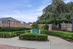 Welcome to this beautifully renovated one bedroom, one bath co-op in the heart of Lawrence. Located on the top floor at the back of the building, it offers peace and quiet while being just one block from the train station and close to shops, dining, parks, and nearby country clubs. A library is located right across the street.The bright open layout includes a modern kitchen with quartz countertops, stainless steel appliances, LED lighting, and soft-close cabinetry. Recessed and dimmable lighting enhances the inviting atmosphere. The spacious bedroom has a large mirrored closet and the updated bathroom features a relaxing jacuzzi tub.Additional highlights include carpeted floors, a dedicated dining area, and plenty of natural light throughout. Building amenities include a private garage parking spot, on-site laundry facilities, a bike room, and a live-in super. This move in ready co-op combines comfort and convenience and is perfect for first time buyers, downsizers, or anyone seeking a low maintenance lifestyle.