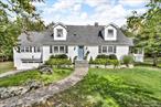 DISCOVER PEACEFUL COUNTRY LIVING in this Cape Cod charmer. . Nestled on a quiet country road, this beautifully renovated Cape Cod home offers the perfect blend of classic charm and modern comfort. From the moment you arrive, you&rsquo;ll be captivated by the peaceful surroundings and thoughtful details throughout. . Step into the sun-drenched eat-in kitchen, where natural light pours in to showcase the quartzite countertops, exposed brick accents, and stainless steel appliances. A generous L-shaped island offers the ideal space for casual meals or entertaining guests while you cook. Just down the hall, a formal dining room with sliding glass doors leads directly to the expansive back deckâ€”perfect for effortless indoor-outdoor gatherings. . At the heart of the home is the stunning Great Room, where soaring cathedral ceilings and a white brick fireplace create a warm, inviting atmosphere. Whether you&rsquo;re curling up with a good book, enjoying music, or hosting friends and family, this space is designed for relaxation and connection. . The first-floor primary suite features craftsman-style French doors, ample closet space, and convenient proximity to the main living areasâ€”making single-level living a breeze. Upstairs, you&rsquo;ll find two spacious bedrooms and a full hall bath, offering plenty of room for family and guests. . Just off the kitchen, a sunny three-season room invites you to enjoy peaceful mornings and golden afternoon light, while the brand-new deck overlooks a sprawling backyardâ€”ideal for outdoor dining, weekend barbecues, or simply savoring your morning coffee in nature. . Additional highlights include gleaming hardwood floors throughout, recessed lighting on the main level, and updates that make this home as functional as it is beautiful. . Walkout basement features loads of storage space, a private enclosed workshop, and over 400sf of additional living space, with bathroom, laundry, and separate entrance leading directly into an office space. Walkout space beneath the deck is 100% rainproof. . Whether you&rsquo;re seeking a serene full-time residence or a country retreat, this exceptional property offers the lifestyle you&rsquo;ve been dreaming of. . Don&rsquo;t miss your chanceâ€”schedule your private showing today and make this beautiful home yours!
