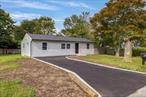 Land lovers delight. Flat corner property, newly redone with new roof, windows, vinyl siding and new driveway with belgium blocks. Interior features include new floors, new kitchen and bathroom. Shower wall features exquisite bamboo wall. Kitchen sink is extra deep for all your cooking. All rooms have cathedral ceilings