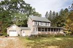 This classic Colonial home, extensively upgraded and maintained, presents an ideal blend of traditional charm and modern comfort in Amenia, NY. The thoughtfully expanded floor plan includes a spacious bonus room added in 2005, creating versatile living space for todayâ€™s lifestyle needs.The welcoming interior flows from an enclosed porch to a living room anchored by a wood-burning fireplace. An expansive country kitchen serves as the heart of the home, complemented by a dining room and a convenient half bath on the main level. The 2005 addition provides flexible space for a home office, family room, or entertainment area.Three comfortable bedrooms occupy the second floor, sharing a well-appointed full bathroom. The layout offers ideal separation between private and social spaces, maintaining the authentic Colonial design while accommodating contemporary living patterns.Set in a peaceful neighborhood with a seasonal brook bordering the rear of the property, this home delivers the perfect balance of privacy and convenience. An attached one-car garage connects to an enclosed breezeway/mudroom for easy transitions. Just minutes from the villages of Amenia, Millerton, and Sharon, CT, with the Wassaic train station only 5 minutes away.