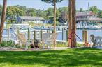 Creekfront Escape w/ 40&rsquo; wide deep water floating dock! This stunning newly constructed waterfront home is perfectly situated on Meeting House Creek. With its large oversized dock and deep water access, this home is a boater&rsquo;s dream. Step inside to discover a spacious interior boasting 3 bedrooms, 3 full bathrooms, and a versatile flex room that can be used as a main floor en-suite bedroom or additional living space. The open concept great room features a chef&rsquo;s kitchen, dining area, and living room, creating the ideal space for entertaining. Upstairs, find two guest bedrooms, including one with a water-side balcony, a full bathroom, and a truly impressive master bedroom with an en-suite bathroom and water-side balcony. Outside, the rear yard offers a large stone patio, fire-pit, and a red brick walk-way that leads to the home&rsquo;s impressive deepwater dock. Located on Overlook Dr, a private road that juts out into the bay, you&rsquo;ll enjoy fantastic water access to the Great Peconic Bay and all it has to offer.