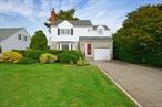 Welcome to this expansive 4-bedroom, 3 full bath Colonial offering over 2, 600 square feet of interior living space, ideally situated on a beautifully landscaped 60 x 126 lot on picturesque Garden Street. The main level boasts a sun-drenched formal living room featuring a bay window, cozy fireplace, and brand new hardwood floors. Adjacent is the formal dining room, also with new hardwood flooring, and direct access to a charming enclosed sunroom - perfect for morning coffee or evening relaxation. The spacious eat-in kitchen flows seamlessly into a massive 28â€™ x 17â€™ family room, providing the perfect setting for entertaining and everyday living. A convenient first-floor laundry room and a full bathroom complete this level. Upstairs, you&rsquo;ll be impressed by the generously sized primary suite, complete with two walk-in closets and a private ensuite bathroom. Three additional well-proportioned bedrooms and another full bathroom provide plenty of space for family, guests, or a home office. Additional Highlights Include: attached 1-car garage, unfinished basement, new gas burner, new hot water heater, double-wide driveway and close proximity to Grove Park and Locust School. With its spacious layout this home offers endless possibilities for comfortable living and future customization. Donâ€™t miss the opportunity to make it yours!