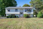 Tucked away on a quiet cul-de-sac in the Lakeland School District, this Mahopac home welcomes you with everyday comfort and a park-like yard that feels like a private retreat. With breathtaking backyard views and an unbeatable setting, it brings together space, updates, and location in a way that is hard to match.Picture yourself stepping into a sun-filled living room where a striking bow window frames the outdoors like a piece of art. The freshly painted upper level features refinished hardwood floors, new doors throughout, and an updated hall bath with a new vanity, mirror, and shower doors. The three bedrooms on this level are filled with natural light and offer flexibility for rest, creativity, or quiet retreat in this raised ranch layout. The seamless flow between living, dining, and kitchen spaces makes it easy to envision everyday living as well as gatherings that extend effortlessly outdoors.The lower level has been thoughtfully refreshed with paint, new luxury vinyl flooring, and an additional renovated full bath. A spacious family room anchors the level, complemented by a versatile bonus room. Whether you need a home office, gym, recreation area, or extra living quarters, this level adapts beautifully to your needs and offers the flexibility to grow with you over time.Step outside to find the feature that truly sets this home apart: a freshly painted deck overlooking an above-ground pool and a backyard that seems to stretch endlessly. Few properties offer a yard like this, expansive, private, and park-like. Imagine relaxing here on summer afternoons, dining al fresco in the evenings, or simply enjoying peaceful mornings with coffee. With space for gardening, entertaining, or unwinding in complete tranquility, the outdoor living is as inviting as the inside.With a one-car garage, ample parking, attic storage, and central air, comfort and convenience are already built in. Located just over the Westchester border, this home is minutes to shops, restaurants, schools, golf courses, parks, and the North County Trailway. Quick access to parkways makes Manhattan just over an hour away, offering suburban serenity without losing commuter convenience. Lovingly maintained over the years, this home presents a rare opportunity to move into a neighborhood known for its appeal. With its desirable location, thoughtful updates, and exceptional outdoor space, this home is ready to welcome its next chapter and it could be yours.