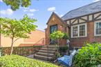 Lovingly maintained and ready for its next chapter, this hard-to-find semi-detached two-family brick home enjoys windows on three sides for abundant natural light and cross-ventilation. Original architectural details showcase the homeâ€™s character, including coved ceilings, a slate roof, and arched openings; a skylight and transom on the upper floor further flood the interior with light. Hardwood flooring, several ceiling fans, and freshly painted interiors enhance the appeal. The top-floor residence is a spacious five-room, two-bedroom layout with a beautifully renovated bath and a kitchen featuring quartz countertops, stainless-steel appliances, and a handy pot filler; the original arched opening connects the kitchen to the dining area seamlessly. The walk-in level offers a one-bedroom with an extra-large living room, windows in every room (including a windowed bath), and an eat-in kitchen that opens directly to the rear yard for easy indoor-outdoor flow. Potentially unused square footage on the lot with expansion possible, but must be confirmed independently with your architect. Outdoor space spans both the front and back of the property, with a well-manicured yard ideal for seating and gardening, and private rear parking that can accommodate multiple vehicles; an updated tankless hot-water system and two-zone heating add modern efficiency. Conveniently located in East Elmhurst, the home offers easy access to LaGuardia Airport, the Grand Central Parkway, the RFK/Triborough Bridge, and the 7 train, while the Q33 bus is just steps away.