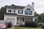 Colonial with 8 rooms 4 beds and 2.5 bath located in Wyandanch schools