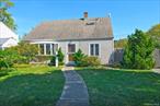 Charming, Expanded Cape Cod on Quiet Street. Spacious Living Room with Fireplace. Formal Dining Room. Very Large Primary Bedroom with Lots of Closets.  2 Full Baths. Fully Fenced Yard.  Anderson Windows. Updated Heating System. UpGraded Electric. Updated Baths. Close to Shops, Transportation, Schools and Community Pools, Playgrounds & Library.  Award Winning School District.