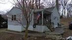 Welcome Investors and Builders - Home in Northport in need of TLC. Ideal starter home, with new siding, wood porch, wood floors and large property.
