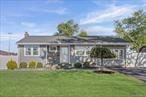 Beautifully updated 3br 2bth ranch w/full finished bsmt split up w/2 separate entrances. Renovations, include new roof , siding (2 Yrs old), windows (5yrs), sleek paver walkways , front stoop, stone entry, 200 amp electric w/ additional 30 amp w/2 extra lines, split ac unit (4yrs), water heater(3yrs), gas heat and cooking, new kitchen w/SS appliances, granite countertops, center island, hardwood and tile flooring, renovated tile bathroom, manicured landscaped grounds and so much more ! Close to all !