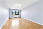Spacious and sun-filled 2-Bedroom, 1-Bath Corner Co-op in the heart of North Flushing! This desirable unit features a southern exposure that brings in abundant natural light, complemented by beautiful hardwood flooring throughout. The recently renovated windowed kitchen boasts custom double-sided cabinetry, elegant granite countertops, and sleek stainless-steel appliances. The modern full tiled bathroom offers both a stand-up shower and a window for added ventilation. Generous storage includes double closets in the primary bedroom and an additional closet in the secondary bedroom. Updated dual-pane windows enhance comfort and efficiency. Located in a well-maintained elevator building with low monthly maintenance, this home offers unbeatable convenience. Close to schools, local buses, and major public transportation, making commuting and daily living a breeze.
