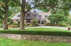 Introducing Terry Manor, a beautifully and thoughtfully restored and completely renovated architectural treasure that seamlessly blends modern sophistication with timeless architectural detail and craftsmanship. Perfectly nestled in the heart of distinguished Lawrence Park West, this residence is located within a short walk to Bronxville Village and less than 30 minutes from Manhattan, offering the perfect balance of suburban tranquility, city convenience, and low taxes!Originally crafted by celebrated architect Lewis Bowman as the dream estate for Paul Terry, creator of Terrytoons, 21 Hampshire Road features a rich cinematic history and has recently appeared on HBO and NBC productions. Sophisticated finishes, exquisite artisanal tile and stonework, and state-of-the-art technology come together with striking details and bespoke touches to enjoy and impress at every turn. The elegance and warmth makes this residence equally suited for both formal entertaining as well as casual, everyday living. Noteworthy highlights of this spectacular Tudor include a beautiful formal living room with a barrel ceiling, magnificent restored Cuban mahogany wood paneling, and an original wood-burning fireplace with Rare Rosso Levanto marble surround and herring-bone limestone interior, all in pristine condition. The gourmet chef&rsquo;s kitchen features top-of-the-line appliances, Calcutta Oro marble countertops, including an oversized center island, luxurious custom cabinetry, and breakfast area which opens to a lovely family room with custom built-ins. On the second level, the primary bedroom suite impresses with soaring cathedral ceilings, a coffee/drink area, and a breathtaking spa-inspired bathroom featuring radiant-heated floors, a built-in sauna, and a dramatic hand-carved black granite soaking tub. A boutique-style dressing room and second full bath with a steam shower complete the primary bedroom retreat. Three additional bedrooms, including a guest bedroom with ensuite bath, ensure comfort and conveniences for family and visitors alike.Throughout the residence, each and every detail has been elevated: custom leaded-glass windows with double insulation, luxurious Rohl and Kohler fixtures, hand-selected tile and stone, and wide-plank white oak floors that radiate warmth. Smart-home technology takes center stage with voice-activated controls, video security, integrated sound, intelligent climate and lighting systems, and even smart pool and irrigation managementâ€”all designed to deliver ease and peace of mind. Outdoors, entertain, unwind, and savor the natural beauty of the private property situated on nearly one acre of beautifully landscaped grounds. The expansive slate terrace, complete with a wraparound design, built-in barbecue, and recently refinished pool with PebbleTec finish, new Pentair systems, and LED lighting, makes al fresco living effortless. Terry Manor is more than a residenceâ€”it is truly a legacy property with unmatched provenance, character, and contemporary luxury. Do not miss the opportunity to call this architectural masterpiece your home. Note: Please view the unbranded property video tour,  https://bit.ly/21HampshireRoad