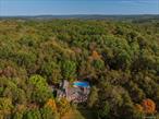 Escape the hustle of city life and discover Bellavista Country Estate, a grand 12, 000-square-foot Georgian brick residence set on over 25 private acres in the foothills of the Berkshires, ideally situated between the Hudson River Valley and the Berkshires. Offering 6 to 9 beautifully appointed bedrooms, including three full suites, five bathrooms, multiple fireplaces, and both a fully stocked eat-in kitchen and a formal dining room, the estate blends elegance and comfort with ease. Recreation and relaxation abound, with a spacious in-ground pool, a serene pond, and direct access to miles of hiking and snowshoeing trails, including those of the Old Chatham Hunt Club. Indoors, guests enjoy a full gym, a game and entertainment room with arcade favorites, a home theater, a library of hundreds of books, and a finished attic, while a 4, 500-square-foot barn with foosball, ping pong, and bar space provides additional room for gatherings and events. Perfect for weddings, anniversaries, family celebrations, and private retreats, Bellavista also offers access to private chefs, caterers, and event planning support, with every detailâ€”from fiber-optic internet and full-house generators to weekly pool and grounds maintenanceâ€”thoughtfully attended to. Since 2011, the estate has been a successful luxury rental for vacations and retreats, equally suited to private full- or part-time residence, a hybrid work-from-home escape, or an unforgettable destination getaway. Just minutes from Chatham, Hudson, and Kinderhook, and a short drive to Lenox, Stockbridge, and Great Barrington, the estate is surrounded by farm-to-table dining, art galleries, organic markets, and the renowned Crandell Theater, with easy access via the Taconic Parkway or I-87 from New York City, I-90 from Boston, Amtrak to Penn Station, or Albany International Airport.