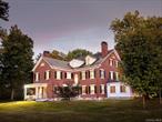 Set on nearly three acres in the heart of Warwickâ€™s historic village, Breckenridge is a commanding example of Greek Revival architectureâ€”its stately brick facade, soaring columns, and symmetrical proportions echoing the grandeur of a bygone era. Built in 1911, the residence spans over 6, 200 square feet across three levels, offering six bedrooms, five-and-a-half baths, and a wealth of original details including seven fireplaces, cathedral ceilings, and a formal dining hall and library. The homeâ€™s architectural elegance is matched by its thoughtful layout, featuring a gourmet kitchen with gas range and pantry, impressive center hall with grand staircase, and elevator access. Add your own touches to this charming estate to bring back to full glory. This estate was built for Morris Rutherfurd, a prominent figure in Warwickâ€™s early 20th-century social and industrial landscape. Rutherfurd, served as president and general manager of the Lehigh & Hudson River Railroad and resided in Warwick until his death in 1944. His legacy reflects the influence of the Gilded Ageâ€”a period marked by opulence, industrial expansion, and architectural experimentation. The homeâ€™s scale, craftsmanship, and stylistic choices are emblematic of that eraâ€™s desire to blend classical European aesthetics with American ambition.Outside, the property continues to impress with a three-car garage, long private drive accommodating up to 20 vehicles, and a fenced, in-ground pool with pool house. Sprinkler systems in both front and rear gardens ensure year-round lushness, while the partly wooded grounds offer privacy and serenity just moments from Main Street. With its rich historical roots and timeless design, this mansion is not just a residenceâ€”itâ€™s a living chapter of Warwickâ€™s architectural and cultural heritage. Warwick, New York offers a rare blend of small-town charm, cultural richness, and natural beauty that appeals to both weekenders and full-time residents. Its historic village center is a walkable haven of 19th-century architecture, boutique shops, art galleries, and locally owned restaurants, creating a vibrant yet intimate atmosphere. The community thrives on connection, with seasonal festivals like Applefest, weekly farmers markets, and summer concerts that bring neighbors together. Nature lovers enjoy easy access to the Appalachian Trail, Mount Peter for skiing and hiking, and nearby Greenwood Lake and Wawayanda State Park for boating, fishing, and birdwatching. Recreational amenities include golf courses, parks, and playgrounds, while agritourism flourishes at local orchards, wineries, and creameries such as Pennings Farm and Bellvale Farms Creamery. Warwick also nurtures a strong creative spirit, with cultural institutions like the Warwick Historical Society and a drive-in theater thatâ€™s been entertaining locals since 1950. Dining and shopping are elevated yet personal, with standout spots like Grappa Ristorante, Fetch Bar & Grill, and a variety of artisanal boutiques. Altogether, Warwick offers a lifestyle thatâ€™s both refined and rootedâ€”perfect for those seeking a deeper sense of place.Conveniently located 60 miles from New York City, less than 90 min drive. Also available is direct bus service to Manhattan via NJ Transit. Ideal for any weekender or commuter.