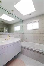 Tottenville-Newly listed - in a great location - 1 Family semi attached - great condition - move in ready! This home is spacious and bright - open layout - street to street lot! Large living dining area with open eat in kitchen L shaped island - 1/2 bath and Sliders to a private yard. 1st floor is fully tiled. 2nd floor consists with Master bed with cathedral ceilings, bed, bed full bath - hardwood floors through-out. Basement has 2 separate areas. Laundry area and utility room, and family room with side entrance - 3/4 bath 2 car driveway, close proximity to SIM buses and local and walking distance to elementary school. Not in a flood zone. Appliances stainless steel Stove Dishwasher Stainless steel refrigerator Washer and dryer