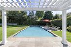 A canvas for creating memories, laughter, and a legacy. Moments from iconic beaches, Michelin-star dining, and designer boutiques, yet tucked away for serenity, this home invites you to imagine lazy mornings, garden parties, and timeless gatherings under the stars. This recently refreshed home is a unique opportunity to live in one of the most desirable locations, in Bridgehampton, south of the highway. It is move-in-ready, with three bedrooms, a sizable pool house, pergola, 40 x 20 gunite pool with sun-deck and spa. On 0.58 acres, the mature trees and hedges surround the property. Make your fall season an enjoyable experience. The property also has health department approval for up to 8 bedrooms, with architectural drawings to build a brand new 4, 800 sq ft home with a 2, 800 sq ft finished lower level. Properties like this with location, privacy, and flexibility rarely come to market.