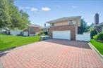 Split Style Home in Herricks School District, Renovated with updated eat in kitchen, 3 full bathrooms, Formal LR, Family Room, Finished basement, attached garage, laundry on site, private driveway. Close to everything, easy access to Highways, LIRR!