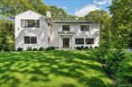 South of the Highway and newly reimagined, this Southampton residence captures the essence of elevated Hamptons living in one of the most desirable enclaves with beach access just down the road. Set on nearly an acre with room for tennis or pickle ball court, this 3, 000+ sq. ft. home offers four bedrooms, four and a half baths, multiple lounge spaces and a sleek heated pool framed by sunlit patios and lush grounds. Inside, a dramatic double-height foyer introduces bright, airy interiors appointed with hardwood floors and refined architectural details. The chef&rsquo;s kitchen, anchored by a striking quartzite island, flows seamlessly into open entertaining spaces. A tranquil primary suite with spa-like bath provides a private retreat, while each additional bedroom has been designed with equal attention to style and comfort. Outdoors, leisure comes naturally: whether relaxing poolside, hosting summer gatherings, heading to deeded beach access down the road or to minutes away to world-renowned beaches, fine dining, and the vibrant Main Street of Southampton Village. Elegant, turnkey, and perfectly positioned, this home embodies Hamptons living at its finest.