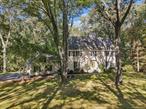 A rare combination of beauty, space, and tranquility in an exceptional Bedford Village location. This home balances country charm with everyday convenience, offering bright and inviting interiors with a timeless, traditional floor plan. The spacious kitchen, flows seamlessly to family room/fireplace with access to an expansive deckâ€”perfect for indoor-outdoor living. The serene 1.5 acre property is bordered by 12 acres of open green space. Formal dining and living rooms, additionally a main level office provides a quiet work or study space. Primary Bedroom and Bath (2021) with radiant heated flooring, soaking tub, shower. Three bedrooms, updated modern hall bath. Walkout lower level with full bath, completely flexible space, media, exercise, recreation, playroom. Freshly painted, hardwood flooring throughout, attached two car garage. 3.8 miles to Bedford Village and Bedford Village Elementary school. 7.8 miles to Bedford Hills Metro North station. A special place where comfort meets convenience.