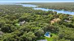 Extremely rare and the only 1-acre parcel of land located within Quogue Village and tucked within a quiet gated cul-de-sac! This property presents a golden opportunity to build your Hamptons estate. Surrounded by neighboring luxury homes with recent sales at $5M+, the setting offers privacy, prestige, and endless potential. This lot allows for a custom 5, 600 +/- sf. two-story estate with the opportunity to finish the lower level, allowing an additional 2, 800 +/- sf. of finished living space. Room for a pool, pool house and pickleball court. Just moments from the exclusive Quogue Beach Club, Quogue Field Club, Quogue Village Center, and Southampton Town beaches, this is your chance to design and build a home that is truly your own in one of the Hamptonsâ€™ most coveted enclaves.