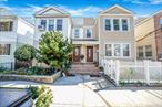 Beautifully maintained legal 2-family home in the heart of Ozone Park! The main level features engineered hardwood floors, a formal living room with extra sitting area, a formal dining room that can serve as a third bedroom, two spacious bedrooms, and an updated full bath. The second-floor unit offers rich cherry-finished hardwood floors, a skylight, formal living and dining rooms, a sitting area, three bedrooms, and a full bath. The finished basement includes a separate entrance, office space, full bath, laundry room, bonus room, and utility roomâ€”perfect for extended family or additional living space. Conveniently located within walking distance to three train lines, multiple bus routes, and three schools, this home combines comfort, functionality, and an ideal location for commuters and families alike. There is gas in the unit.