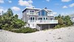 Your Dune Road dream home opportunity is here! Imagine living on one of the most beautiful beaches in the world with panoramic oceanfront views from every room in the house! This four-bedroom, four-bath home features an open floor plan with vaulted ceilings, and floor to ceiling windows in the living room providing fantastic natural light from sunrise to sunset. Each bedroom has its own private balcony with ocean views. The living room and primary bedroom suite each have wood burning fireplaces. This home is located right on the ocean beach path and provides access to Moriches Bay as well. The large outside deck provides plenty of room for entertaining, outdoor dining or just lounging in the sun. The kitchen is well-appointed with a center island and dining area. Located just a short 5-minute drive to the charming village of Westhampton Beach with its great restaurants and shops, this is a rare and unique opportunity to own a piece of paradise.