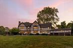 Welcome home to a hidden Hudson Valley gem: a stunning 8, 100+ sq. ft. estate set on 5 private acres, just minutes from the Village of Goshen and only 55 minutes from NYC. This gorgeous home boasts 10 bedrooms and 6 bathrooms, all which have been beautifully updated. This meticulously restored 1907 estate blends historic craftsmanship with modern luxury. Featuring geothermal heating & central air, new plumbing and baths, updated insulation, a newer roof with 50-year warranty, and restored masonry and woodwork throughout. The home offers multiple grand living spaces including a sunroom, game room, library, and an elegant formal dining room. The chefâ€™s kitchen boasts a quartz island and rebuilt butlerâ€™s pantry with new cabinetry and appliances. Rich details include original stained glass, hand-carved chestnut moldings, and seven fireplaces. Upstairs, fully renovated bedroom suites comfortably accommodate large families or guests. The property feels like a private resort with a saltwater in-ground pool, resurfaced tennis/pickleball courts with lighting, and lush park-like grounds. Located in close proximity to the world-renowned Storm King Art Center, this estate is also perfect for equestrian lovers, family retreats, and those seeking an exceptional full-time residence or weekend escape. Minutes to the historic village of Goshen, home to the Harness Racing Museum & Hall of Fameand the Goshen Historic Track (oldest continuously operated horse track in North America). Minutes to the Heritage Trail, LEGOLAND NY, and several major routes. A rare opportunity to own a piece of Hudson Valley history, where timeless charm meets modern living.