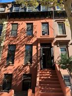 Historic Bed-Stuy Brownstone with Character, Space, and Endless PotentialStep inside this grand three-family brownstone where 19th-century craftsmanship meets 21st-century opportunity. Behind the stately facade, youâ€™ll find original details that define Brooklyn architecture at its finestâ€”ornate Eastlake brass doorknobs, tall parlor doors with intricate millwork, stained and textured glass panels, crown molding, and beautifully aged hardwood parquet floors.Spanning approximately 3, 600 square feet, the property features a flexible multi-family layoutâ€”ideal for an ownerâ€™s duplex with income or a high-yield investment. Live in one unit and rent the others, or reimagine the layout into a luxurious single-family residence. Each level retains unique period features and generous natural light, while the rear garden and mature tree offer a rare urban retreat.The parlor level impresses with its soaring ceilings, carved wood entryway, and double-door vestibule leading to the grand staircaseâ€”ideal for entertaining or restoration enthusiasts who value authenticity. Upstairs, the apartments feature bright rooms with original trim and large windows overlooking tree-lined Marcy Avenue.Outside, the deep private backyard provides a serene escape with space for gardening or outdoor gatherings. The homeâ€™s mechanicals and footprint make it a strong candidate for a high-end renovation or long-term income-producing investment.With its solid structure, period details, and value-add potential, 819 Marcy Avenue stands as the perfect canvas for restoration and long-term equity growth.Located steps from Tompkins Avenue cafes, Herbert Von King Park, and the A/C trains, this property combines neighborhood charm, architectural heritage, and modern convenience. This is a rare opportunity to own a piece of Brooklynâ€™s architectural legacy while building wealth and creating your own story. Schedule a tour of this charming Bed-Stuy brownstone today!