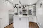 Welcome home to this Dog-Friendly, top-floor, fully renovated 2-bedroom co-op located in one of Astoriaâ€™s most desirable neighborhoods. ALL UTILITIES INCLUDED. Just moments away from top-rated restaurants, local shops, places of worship, and the subway, this home offers unmatched convenience with a quick commute into Manhattan. This bright and stylish unit features a thoughtfully designed open-concept layout, perfect for both relaxing and entertaining. The kitchen boasts a large center island, white cabinetry, stainless steel appliances, and ample storageâ€”plus your own in-unit washer & dryer for added ease. Charming exposed brick accent walls in the living room and primary bedroom add warmth and classic NYC character. As a top-floor residence, enjoy privacy and peace with no neighbors above you. The well-maintained, pet-friendly building allows dogs. This home combines modern comforts with timeless appealâ€”all in a location that puts the best of Astoria right outside your door.