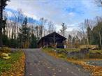 Welcome to this Adirondack retreat. Built in 2009, this custom log cabin is a true gem, offering peace, privacy, and seclusion. Crafted with massive pine logs and designed with an open floor plan, the home combines authentic Adirondack charm with modern convenience. The interior features a great room with vaulted ceilings, exposed beams, woodstove and hardwood floors, creating a warm and inviting space. The main level offers two bedrooms and a full bath. Outside, the property has been thoughtfully improved with a new 26x30 garage, storage shed, wood shed, and above-ground pool with deck for summer enjoyment. The landscaped lawn includes an outdoor fireplace, perfect for evenings under the starsâ€”star gazing here is truly spectacular. A freshly paved driveway leads to the homesite, which is set well back from the road for total privacy. All of this is located just minutes from Great Sacandaga Lake, Caroga Lake, snowmobile and hiking trails, and other year-round outdoor activities. This property includes two parcels (56.-1-42- 18.50 acres & 56.-1-19 - 33.50) Could be sold separately. Do not miss this opportunity.