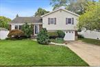 Welcome to this beautifully updated three bedroom, two bath split-level home located on a quiet tree-lined street in the heart of Wantagh. Set on a 7, 500+ sq ft lot in the Seaford School District, this residence blends modern upgrades with classic and contemporary charm.Inside youâ€™ll find a sun-filled living room with hardwood floors, an open dining area, and a renovated kitchen featuring custom cabinetry, granite countertops, and stainless-steel appliances. Upstairs offers three spacious bedrooms and a full bath. The finished lower level includes a cozy family room, bathroom, laundry, and direct access to the attached garage.Enjoy outdoor living on the expansive deck overlooking a fully fenced yard, and established privacy bushesâ€”perfect for entertaining, gardening, or play. Additional highlights include central air conditioning, a whole-house water filtration system, ample storage, and low-maintenance landscaping.Conveniently located near parks, beaches, shopping, dining, and the LIRR, this home is move-in ready and offers the lifestyle youâ€™ve been looking for.