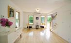 Discover this meticulously renovated 3-bedroom, 2-bath corner property in charming Greenport, offering captivating water views and an expansive, beautifully landscaped garden.The elevated rear garden is a true sanctuary, featuring mature trees and a spacious patio that perfectly frames the picturesque Sterling Harbor, alive with sailboats and fishing vessels. A generous side garden, formerly an additional lot, provides exceptional privacy and ample space for a future pool or extensive landscaping, complementing the existing one-car garage.This restored home has been thoughtfully rebuilt, showcasing its original pine flooring and classic front porch. The inviting lower level boasts an open-concept kitchen and living area, complemented by a sun-drenched room with water views, separated by pocket doorsâ€”ideal for a formal dining room or a versatile third bedroom. A full bath on this level adds convenience.Upstairs, you&rsquo;ll find two comfortable bedrooms and a dedicated small office area, all overlooking the serene rear garden and waterfront. A second full bath completes the upper floor.Beyond the home, boating enthusiasts will appreciate the opportunity for a seasonal boat slip, conveniently located just two blocks away (available for an additional fee). The detached garage also presents an exciting opportunity for a workshop or a future pool house. This home has been thoroughly renovated including a Nevien gas hot water cast iron radiator system, all new plumbing, electric, new town sewer, new roof, new Andersen windows, new walls and insulation throughout. All of this is just a short stroll from the vibrant heart of Greenport village and the sandy shores of Manhasset Beach. Owner/Broker